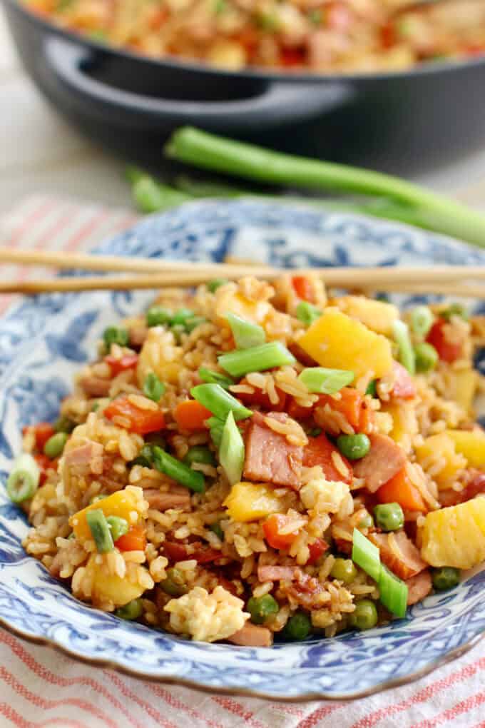 Pineapple Fried Rice with ham and veggies in a blue bowl