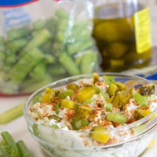 close up of dill pickle dip in a clear bowl