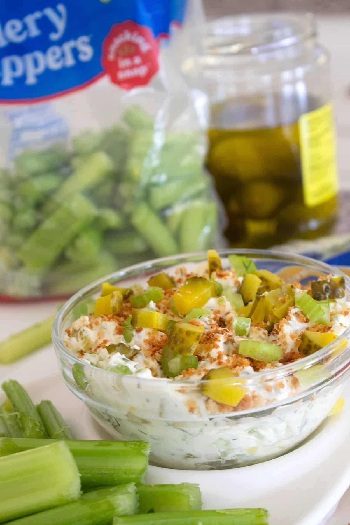 close up of dill pickle dip in a clear bowl