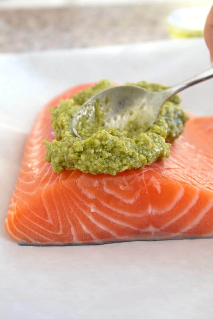 pesto spreading on salmon