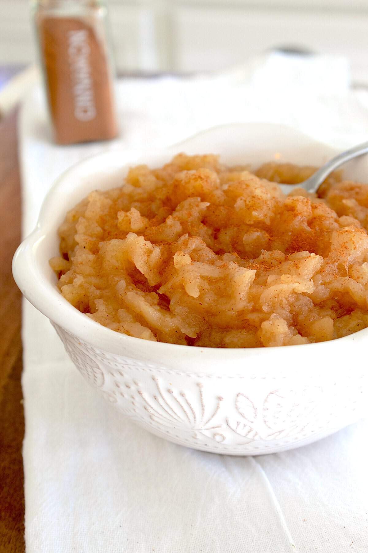 white bowl full of applesauce