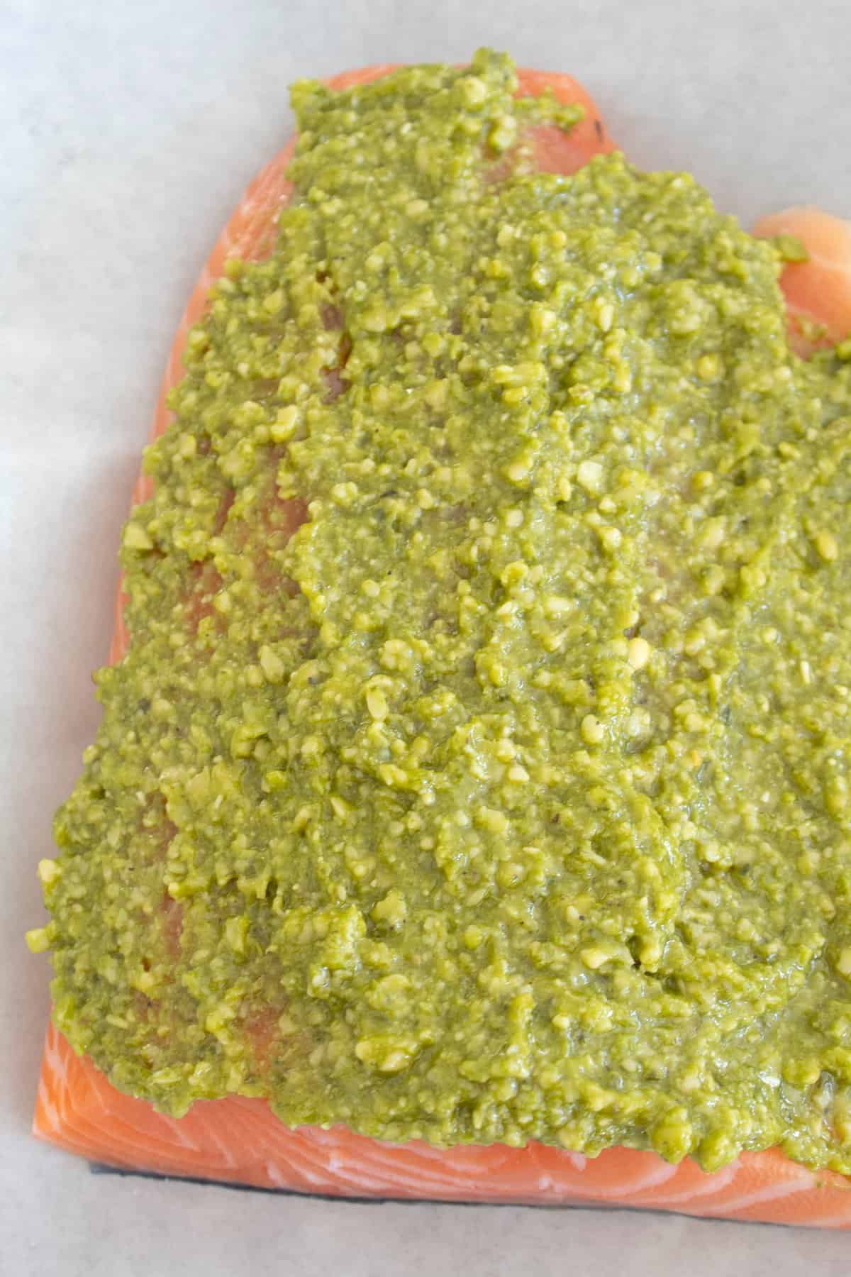 pesto coated salmon on a sheet pan