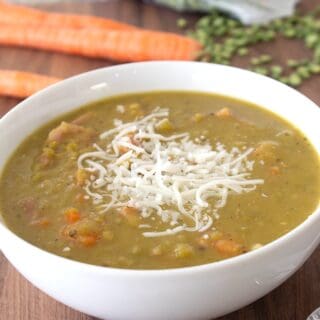 bowl of split pea soup with melted cheese