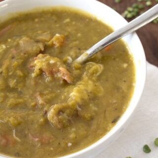 overhead view of split pea soup in white bowl