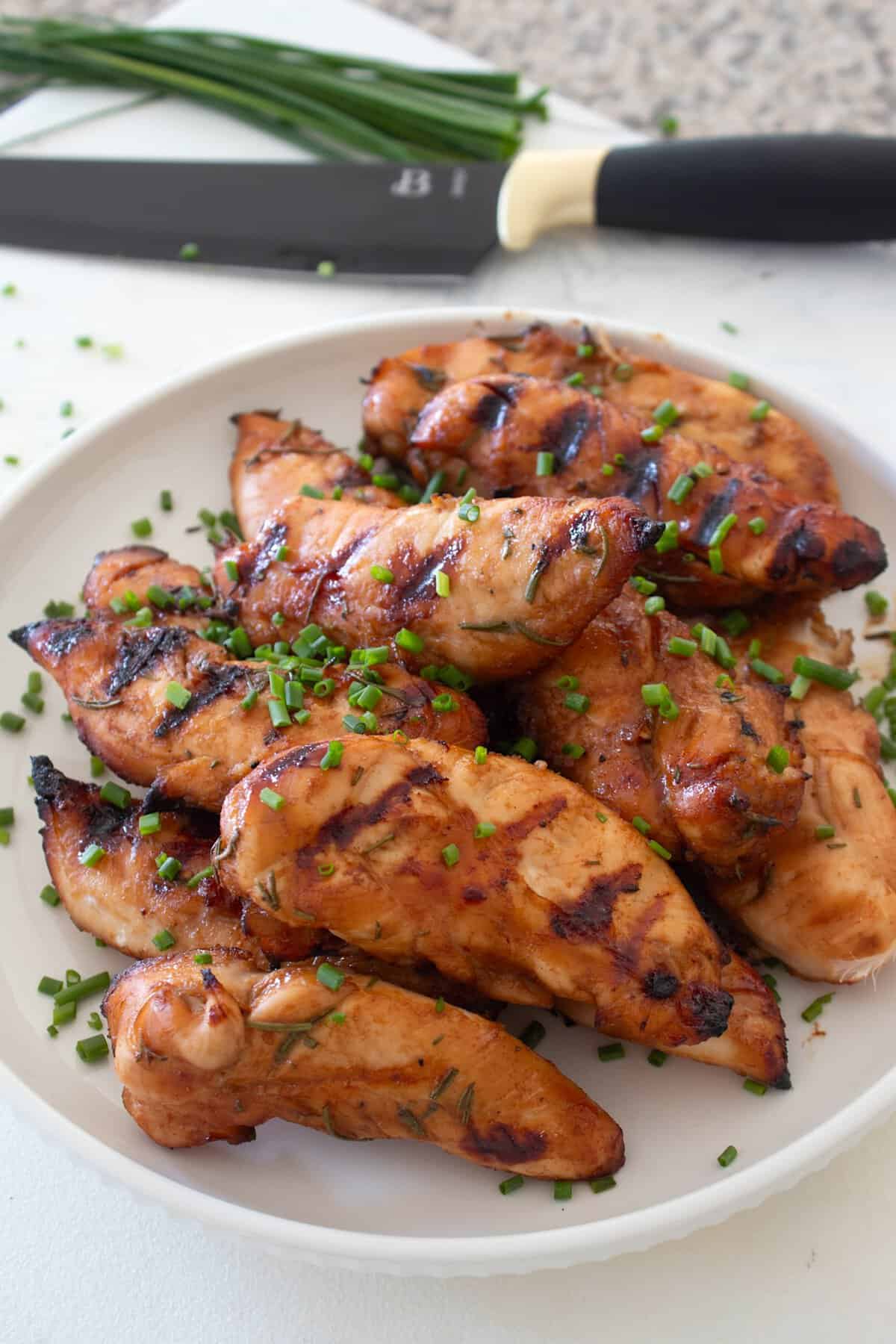 grilled chicken tenders on a white plate