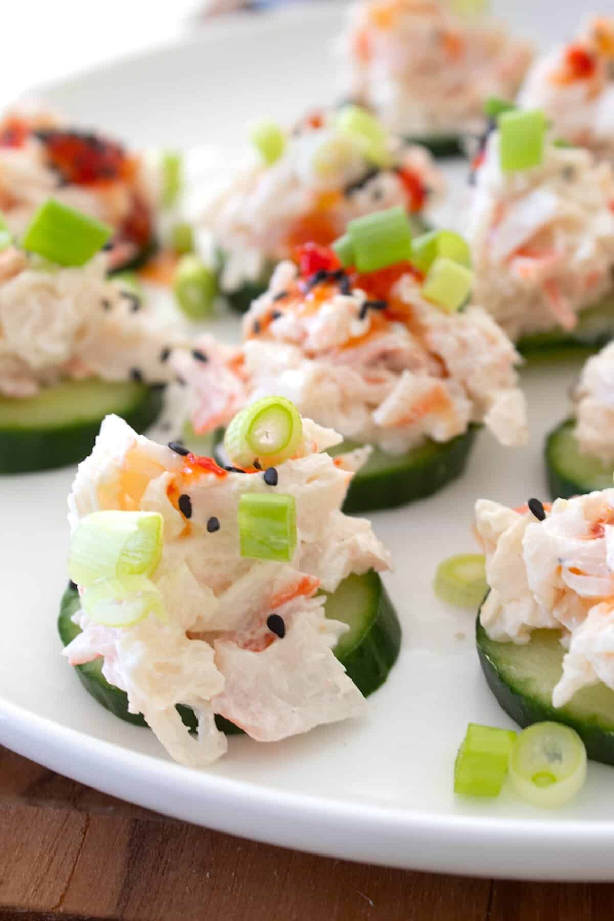 side view of cucumber bites on a plate