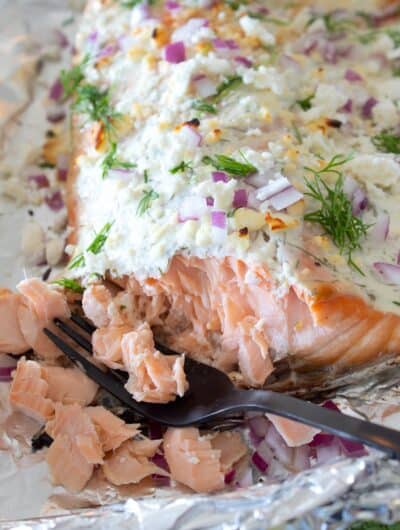 overhead view of greek yogurt baked salmon on a foil lined pan