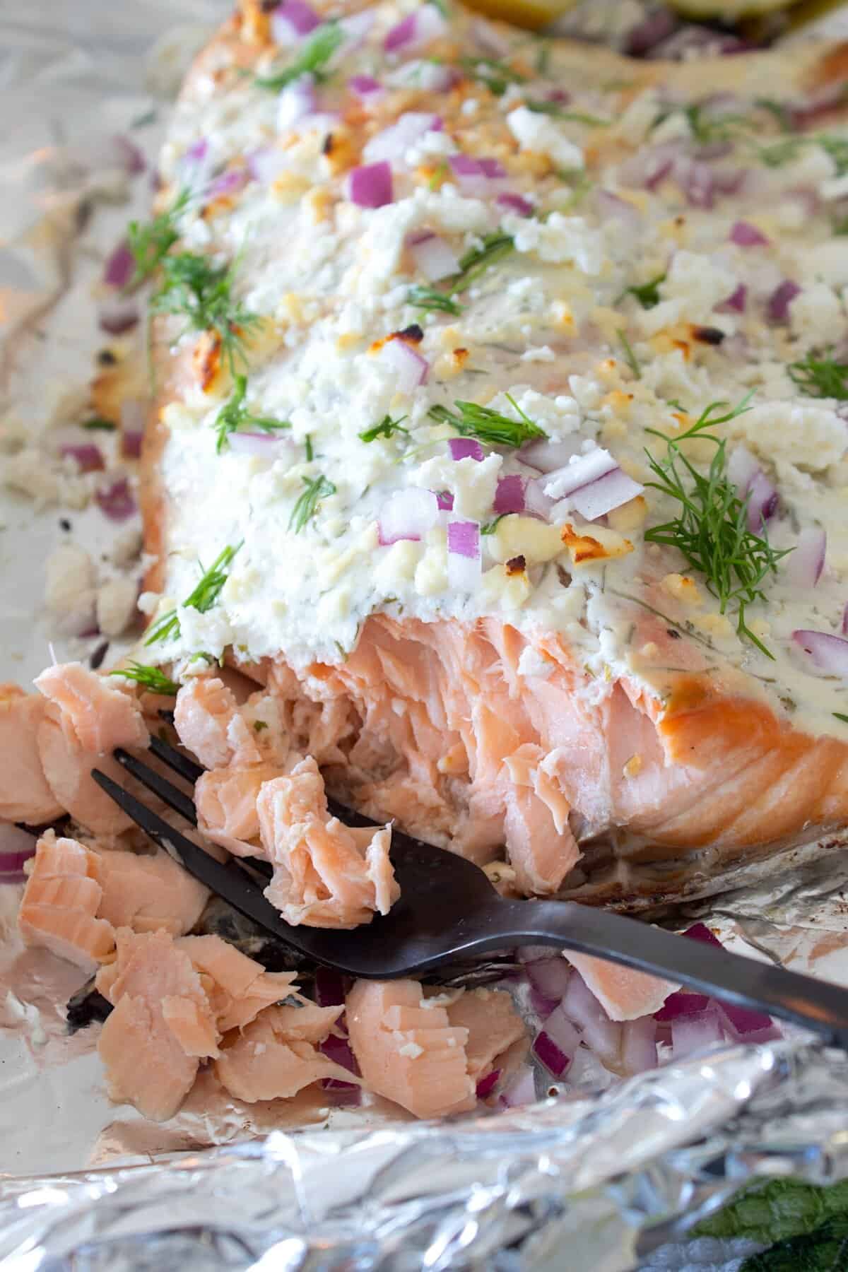overhead view of greek yogurt baked salmon on a foil lined pan