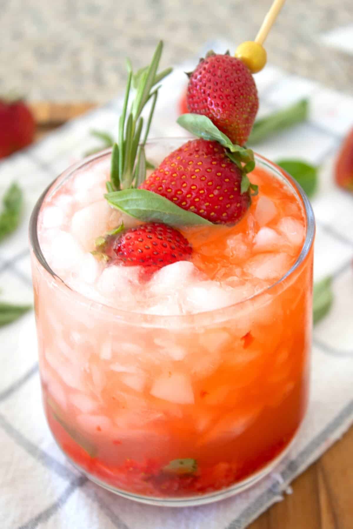 strawberry basil lemonade in a glass with garnish