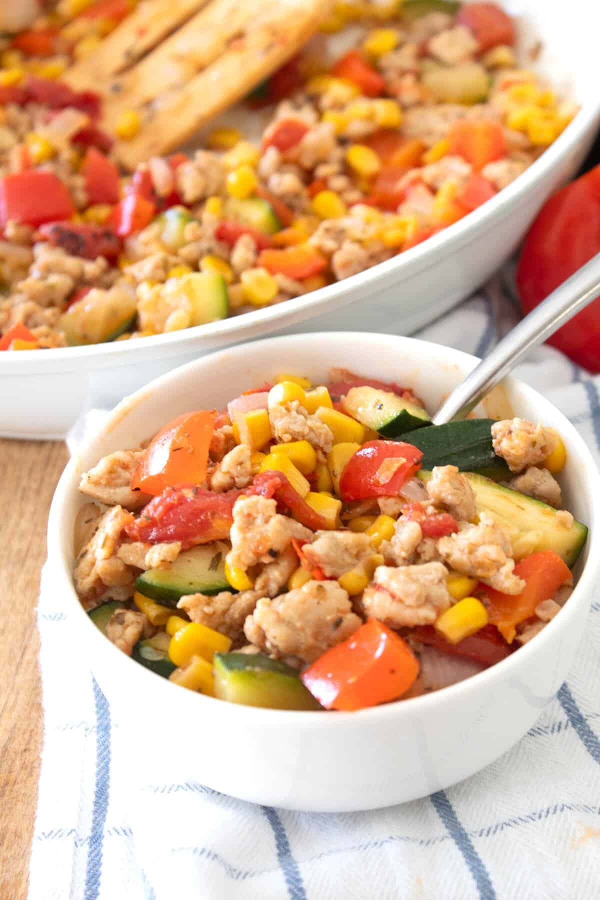 bowl of chicken and zucchini dinner over rice