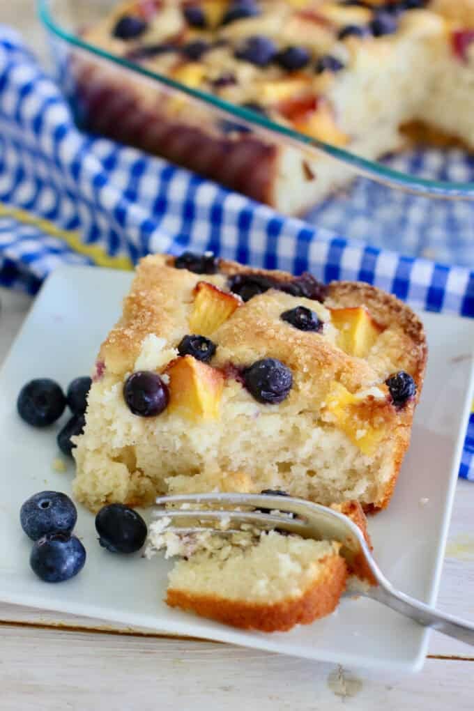 a slice of yogurt cake on a white plate