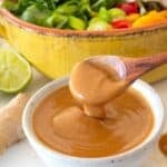 spooning thai peanut sauce in a small dish
