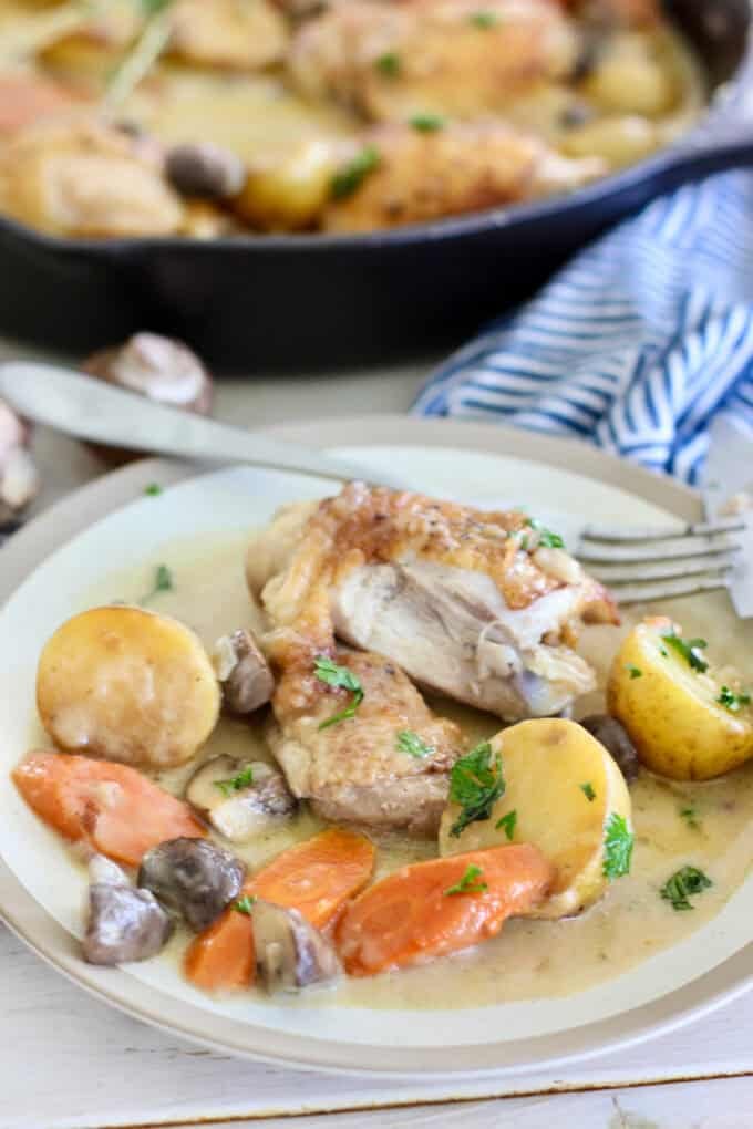 French chicken served with sauce and veggies