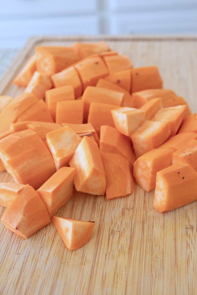 cut sweet potatoes on a cutting board
