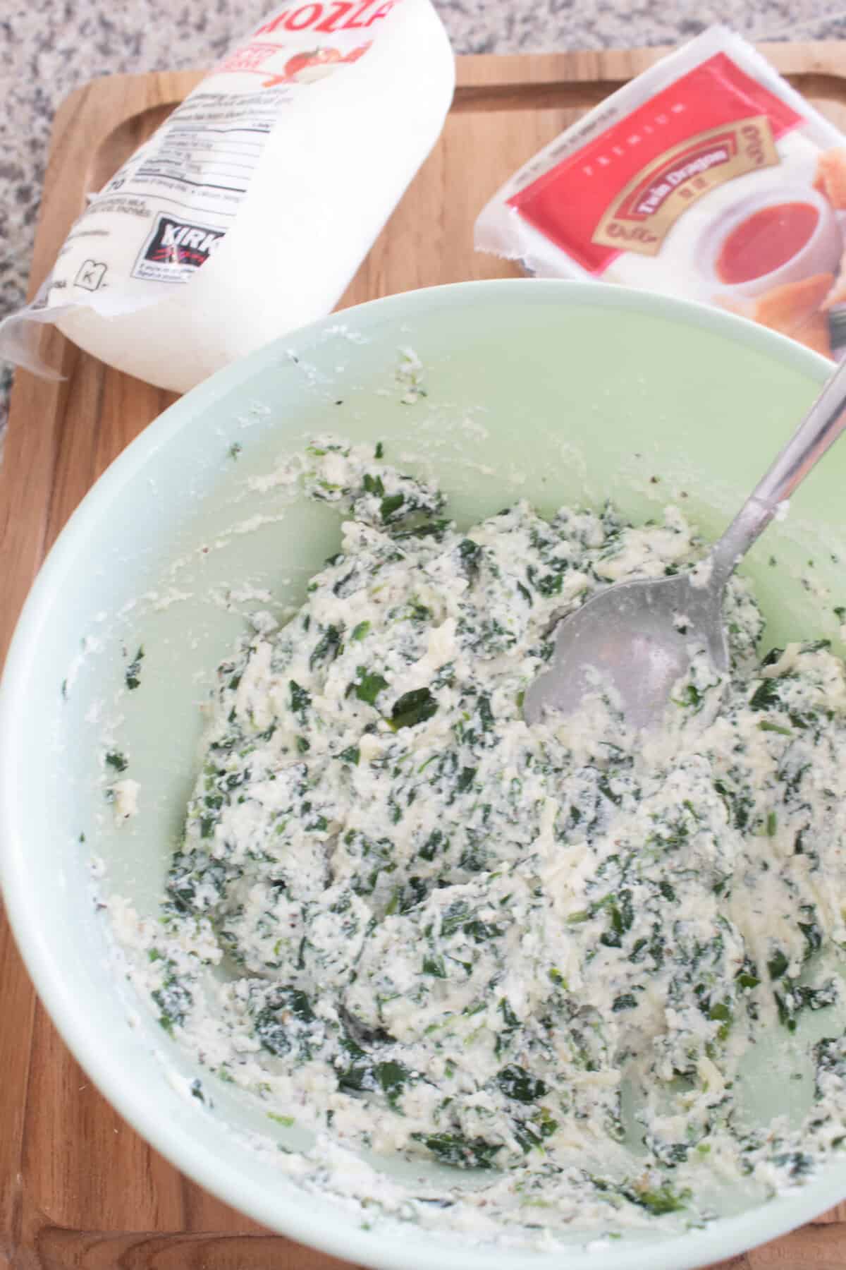 light green bowl full of filling