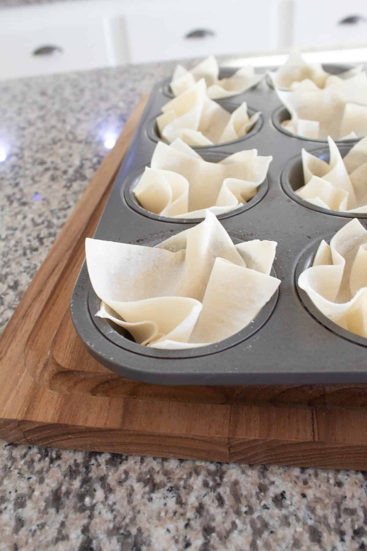 wonton wrapper in a muffin tin