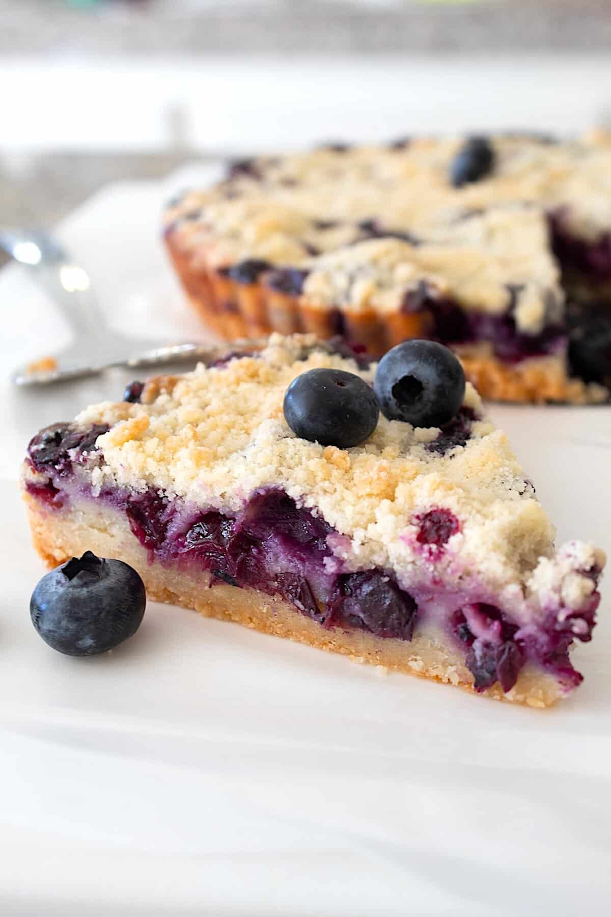blueberry crumb bar on a cutting board