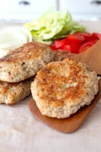 chicken burger patty on a spatula