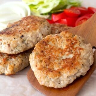chicken burger patty on a spatula
