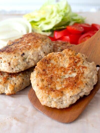chicken burger patty on a spatula
