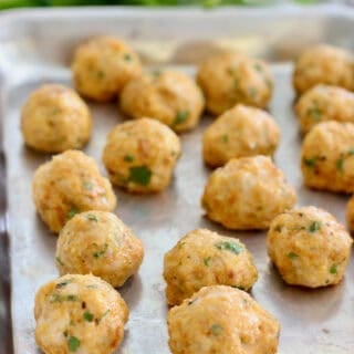 baked chicken meatballs on a sheet pan
