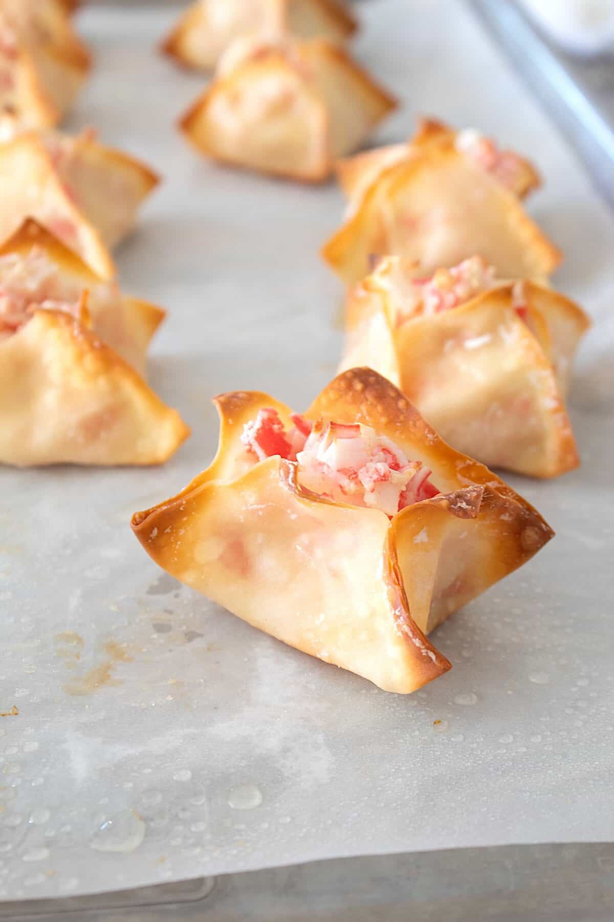 baked wontons on a sheet pan