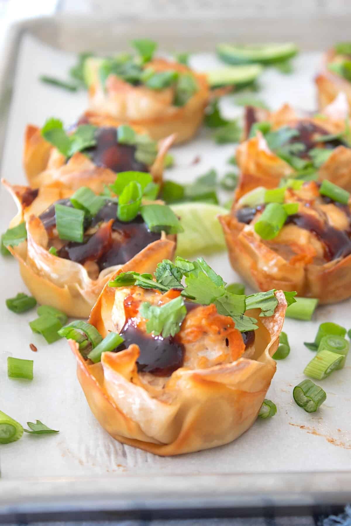 banh mi wonton cups on a parchment lined platter