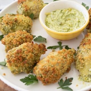 pesto artichokes on a white plate