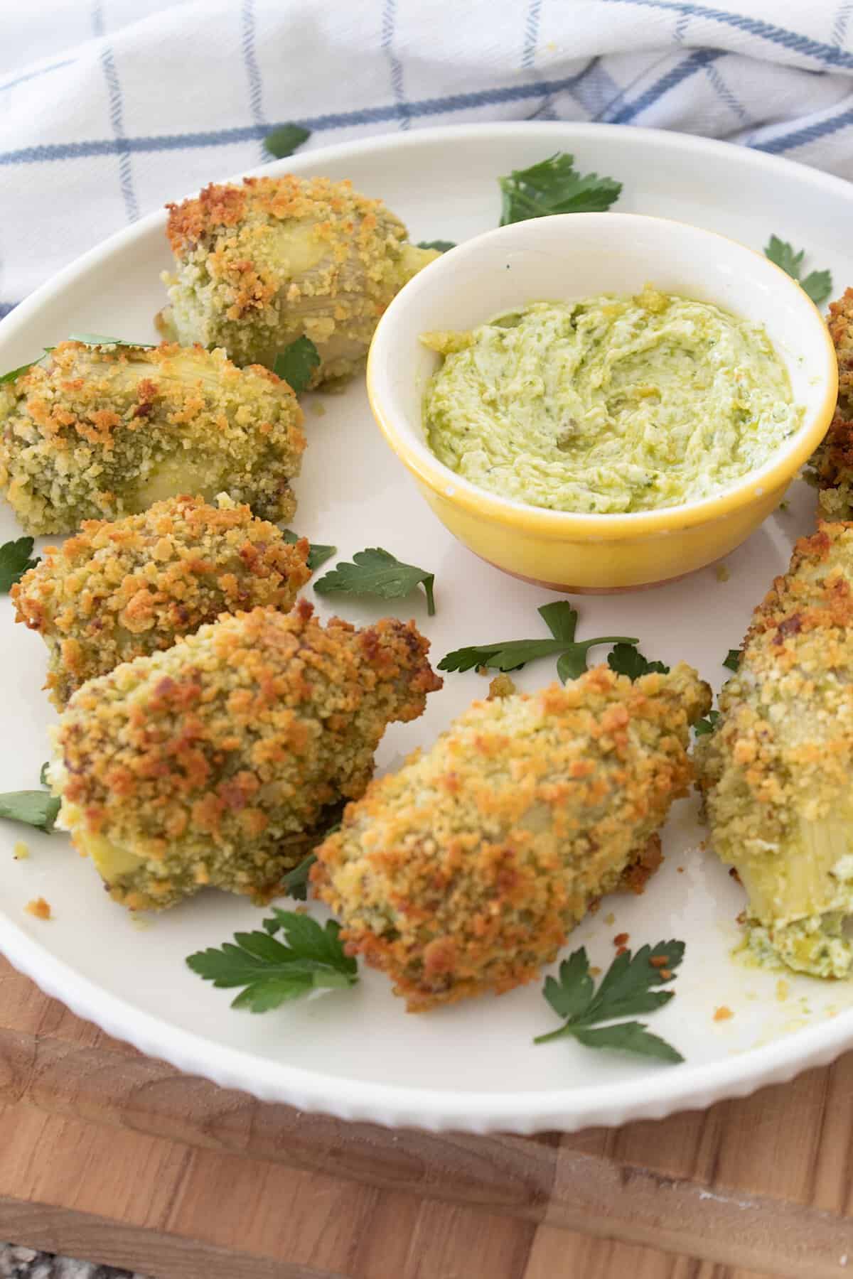 pesto artichokes on a white plate