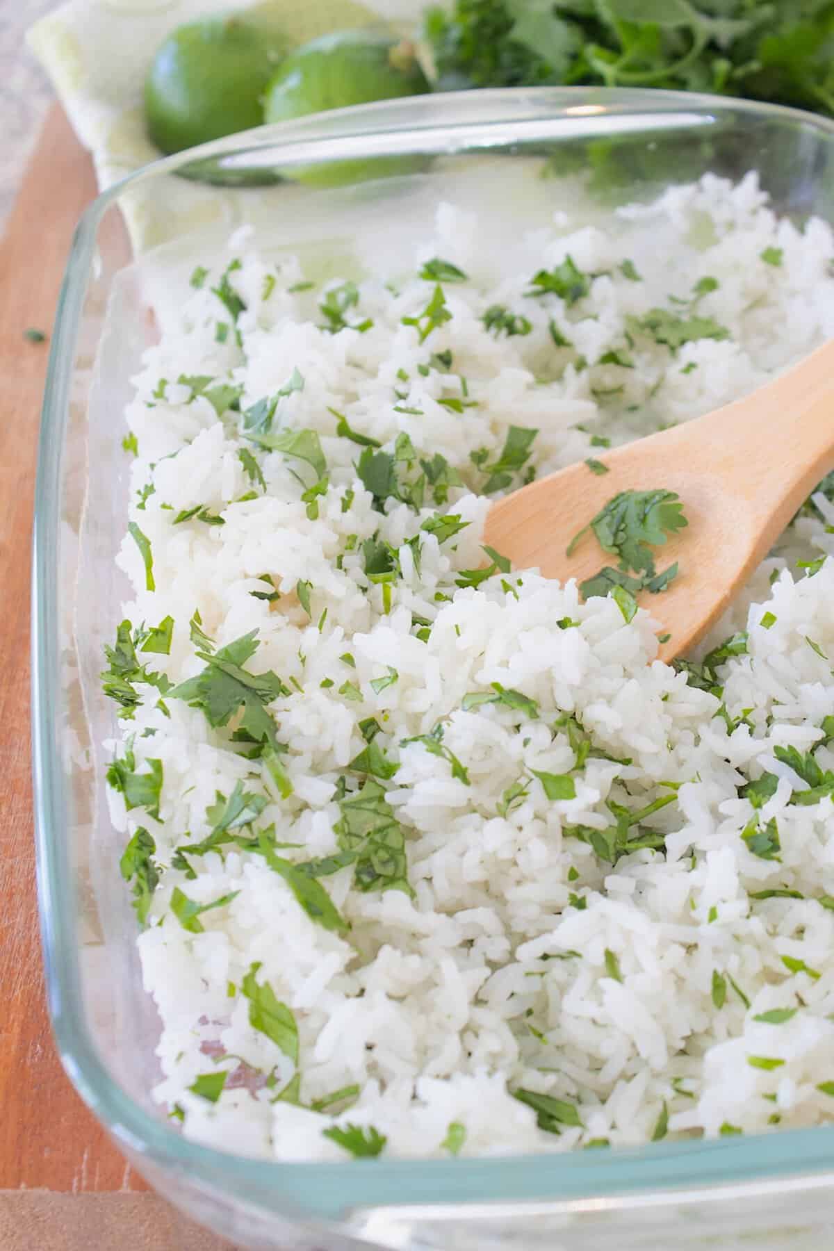 cilantro lime rice in a casserole dish before adding lime