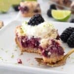 closeup of blackberry pie bar on a white plate
