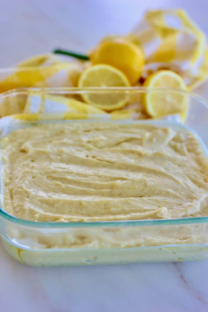 Lemon cake batter in an 8 x 8 pan