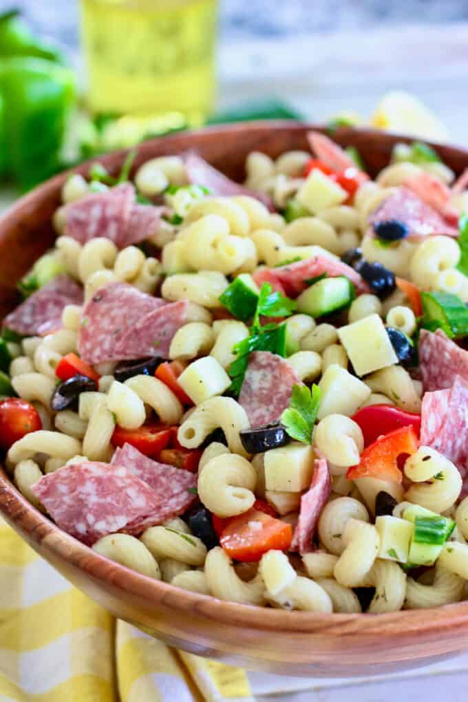 Italian pasta salad in a wooden bowl