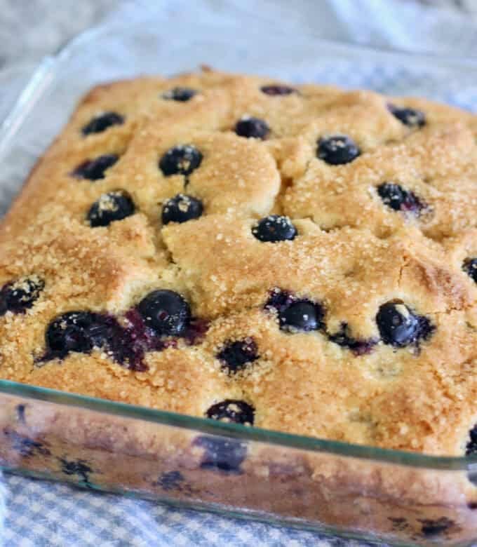 blueberry cake just out of the oven in a 8 x 8 pan