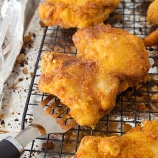 crispy crunchy chicken on a sheet pan with a rack