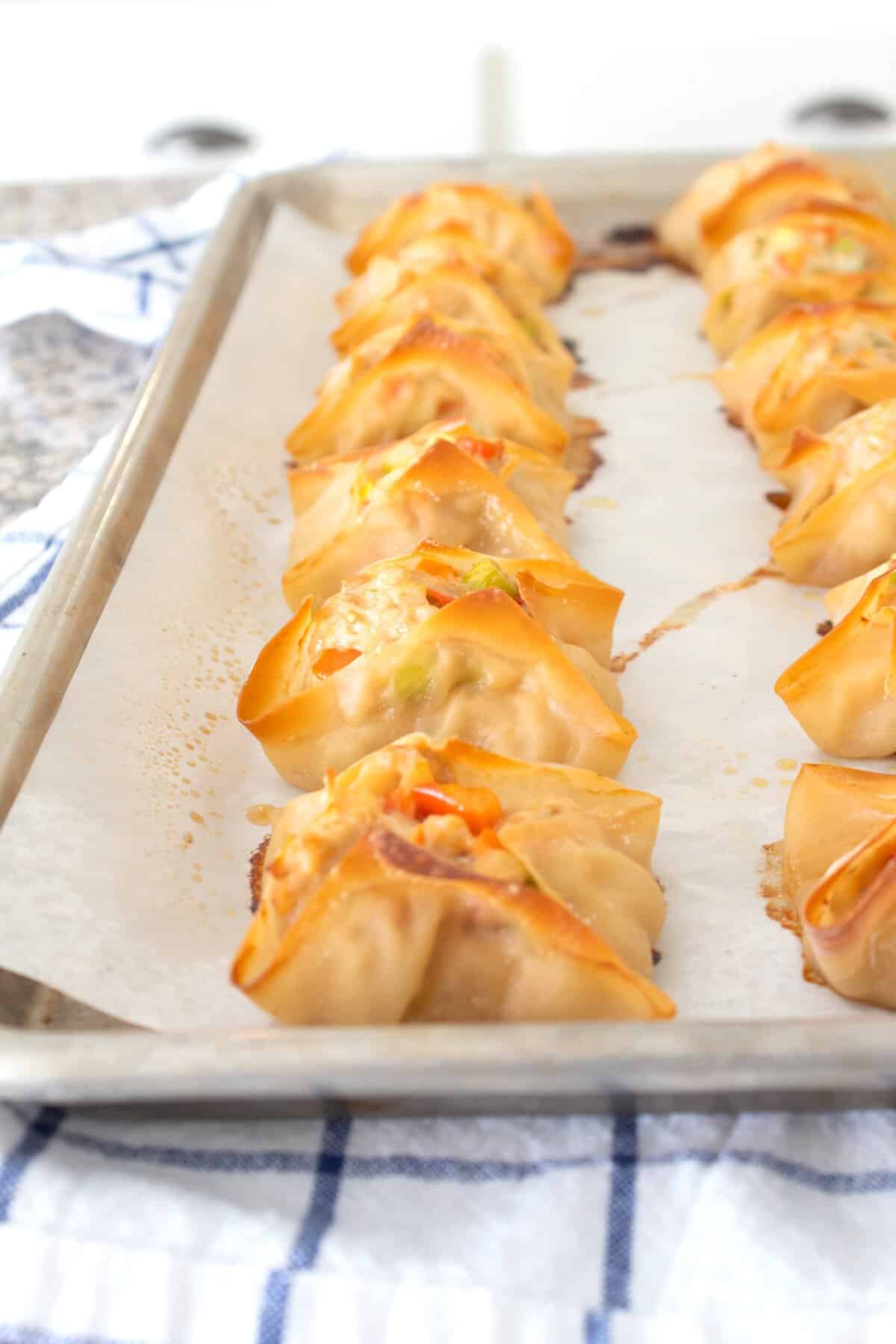 baked chicken dumplings on a sheet pan