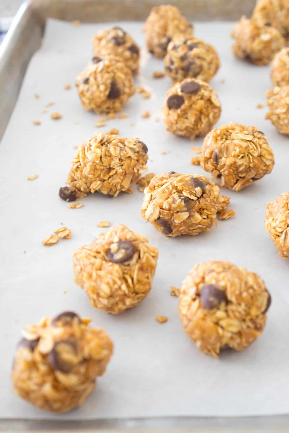 side view of peanut butter balls on pan